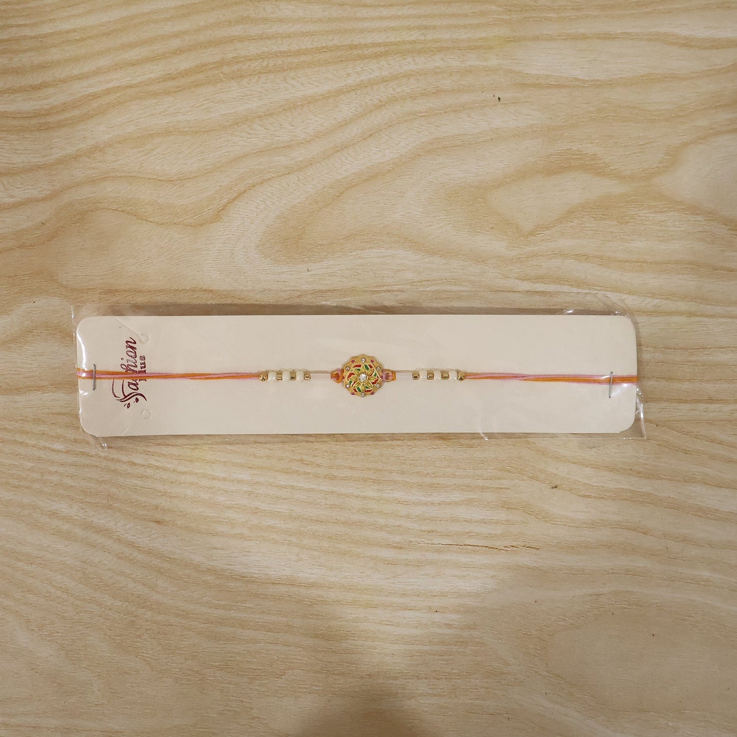 Full view of the Floral Rakhi with white beads, blending traditional and modern styles.