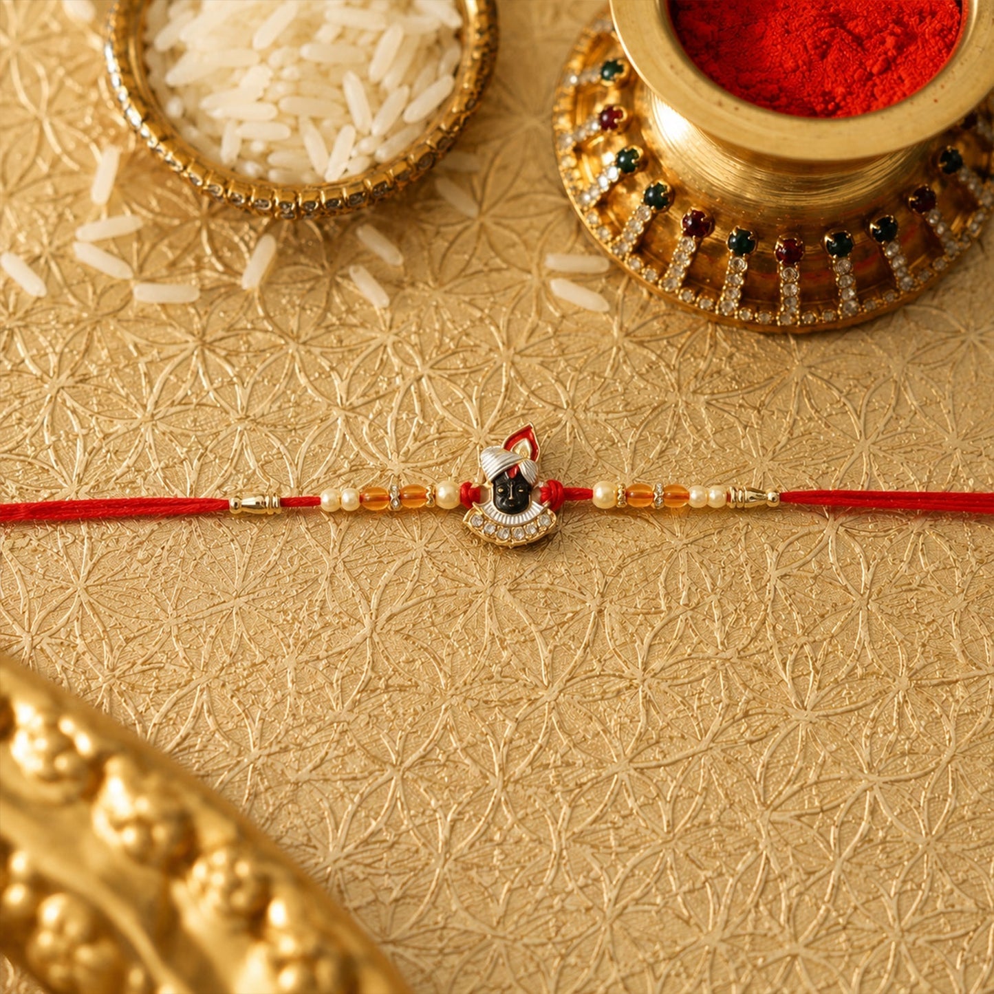 Side view of Shrinathji Rakhi with pearl bead details