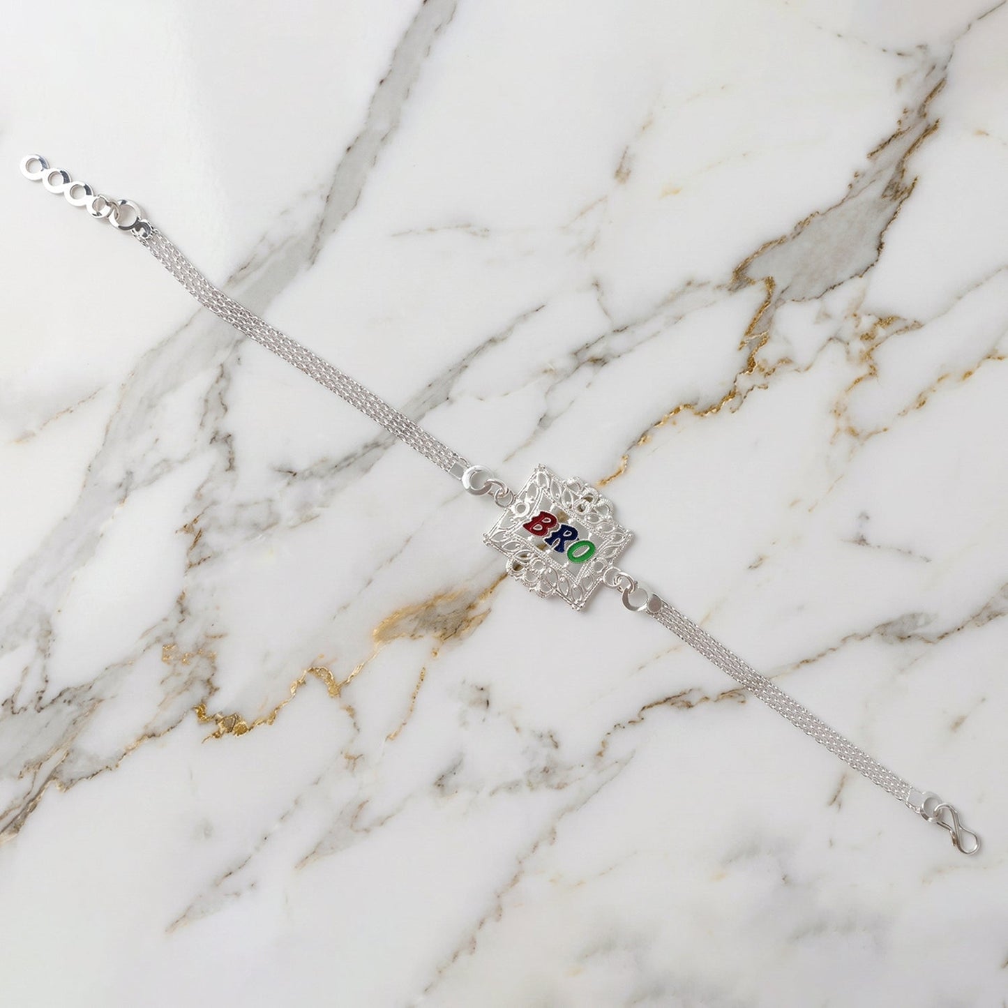The stylish Silver Rakhi for Brother displayed on a pristine white background.