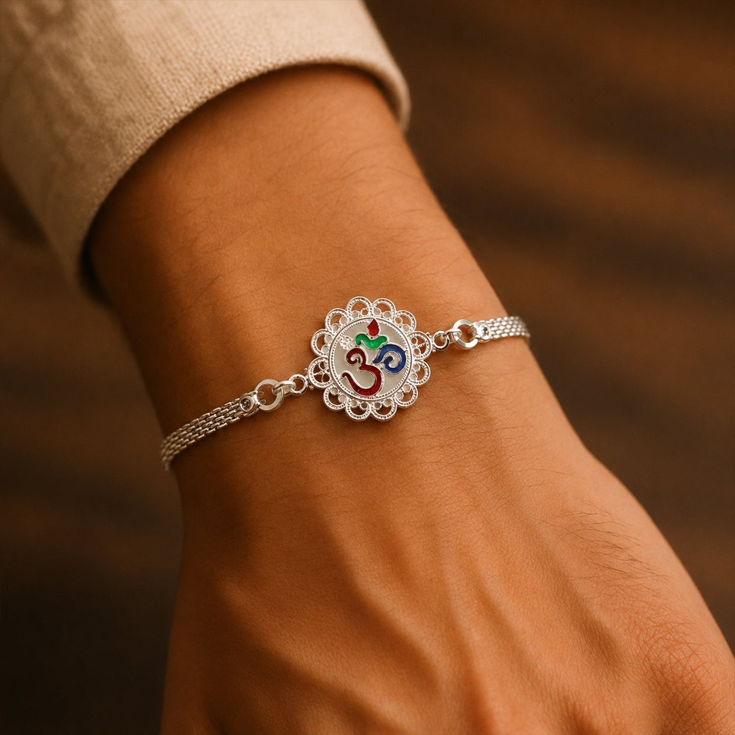 Silver Om chain Rakhi tied with red thread, festive design