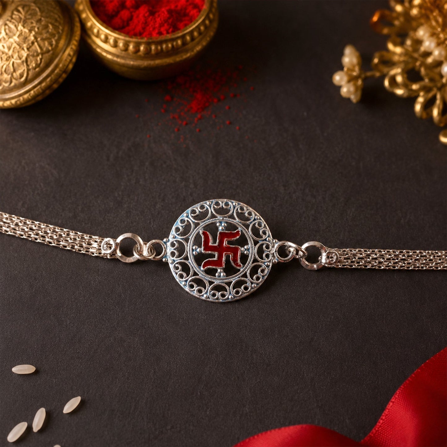 Designer Silver Swastik Rakhi with round decoration