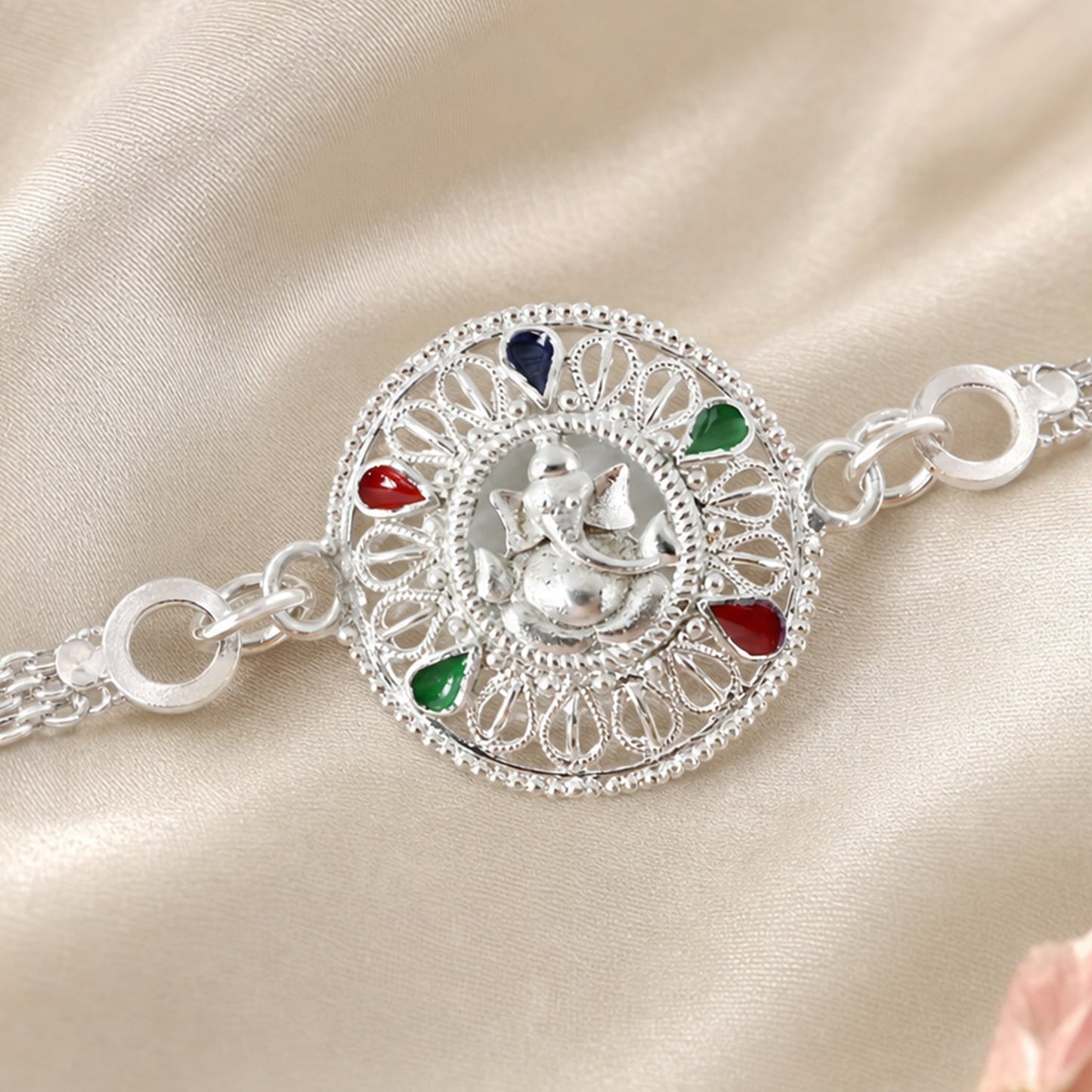 Close-up on Ganesh motif detail of Silver Rakhi