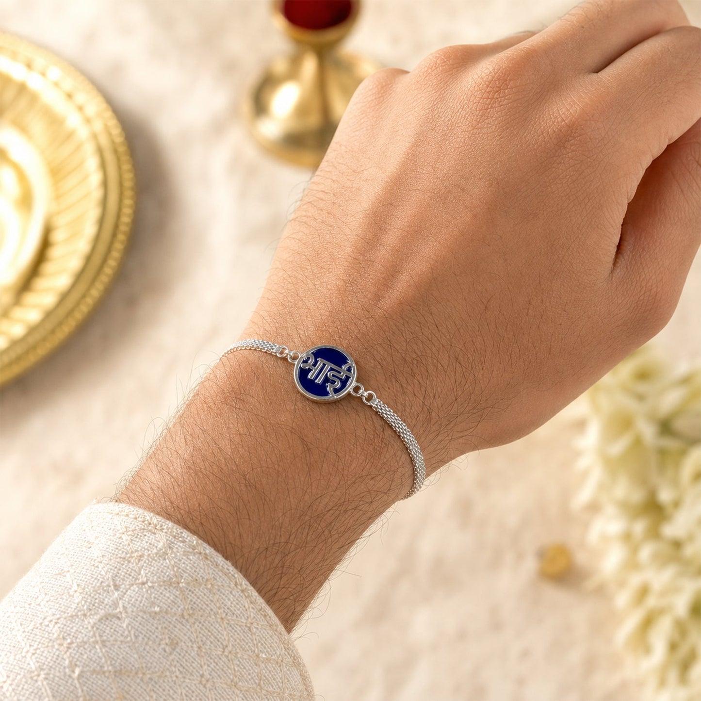 Detailed view of polished Silver Chain Rakhi.