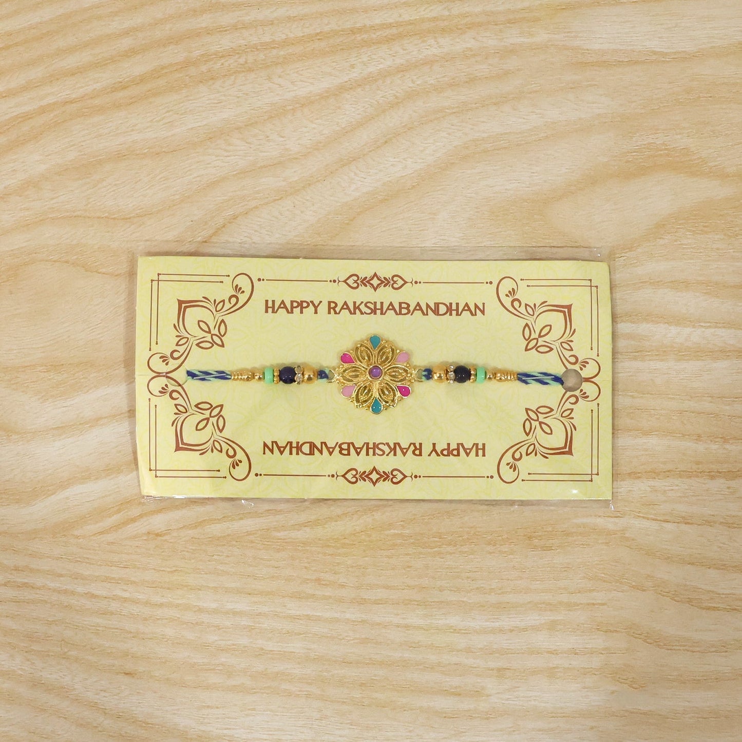 Lightweight floral beaded rakhi with floral charm