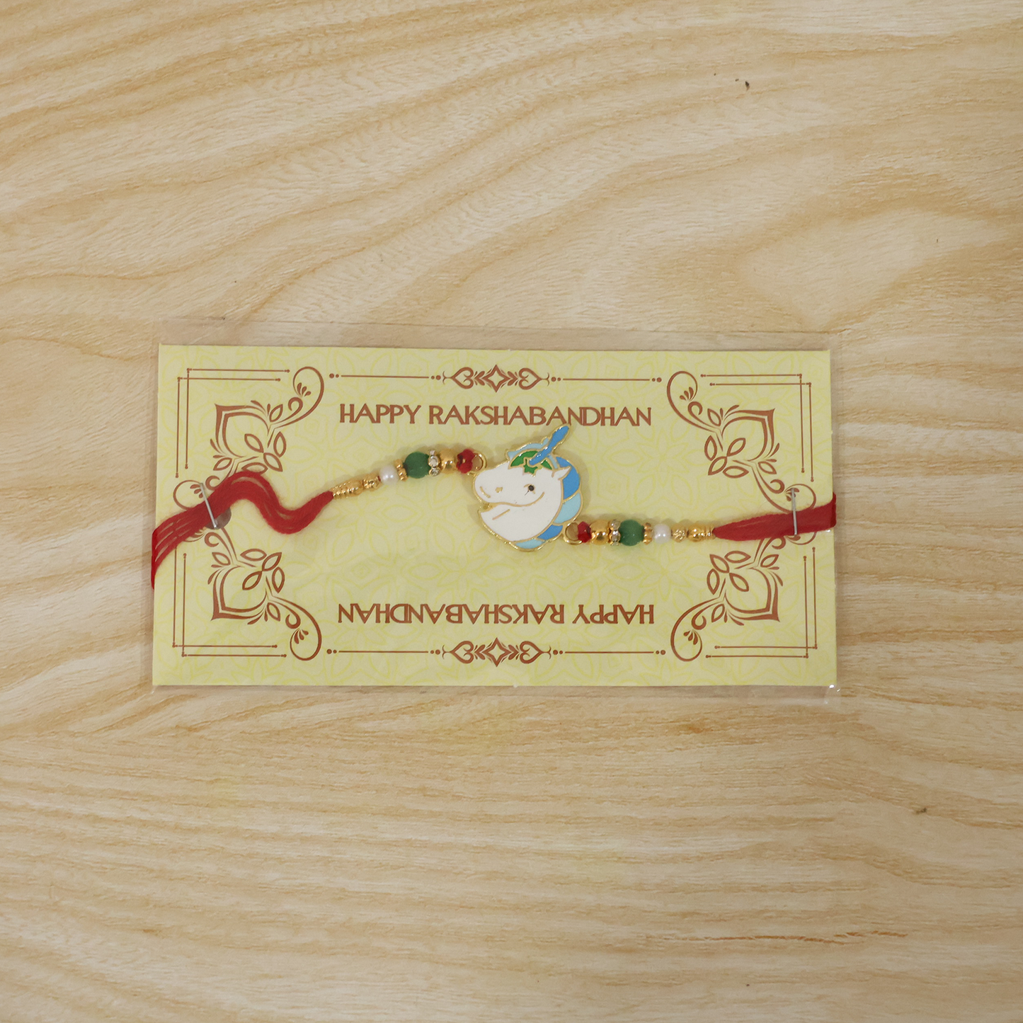 Bright beaded unicorn rakhi on festive style