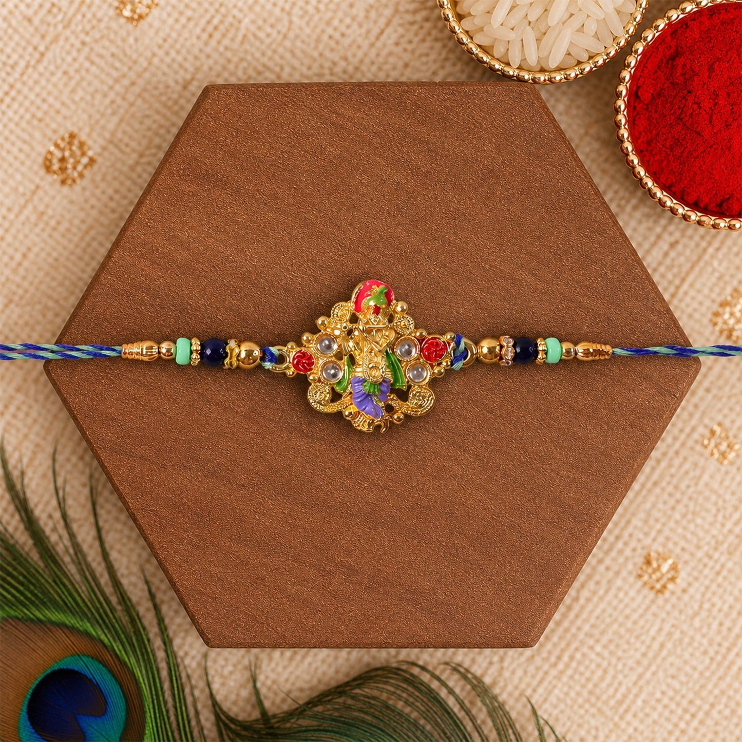 Festive rakhi with beads and divine idol charm