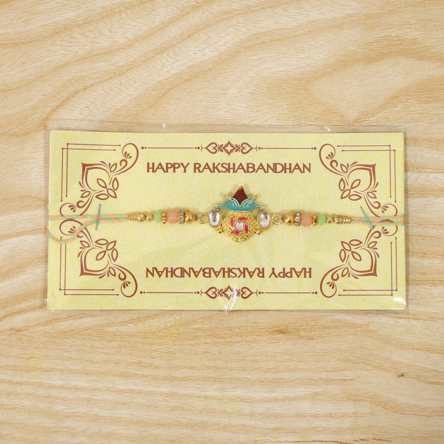 Elegant bead and charm design of Kalash Kundan Rakhi