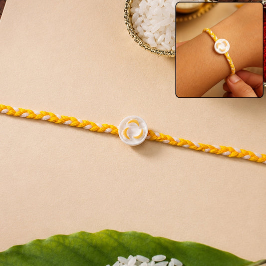 Front view of White Round Charm Fancy Dori Rakhi featuring a stylish design