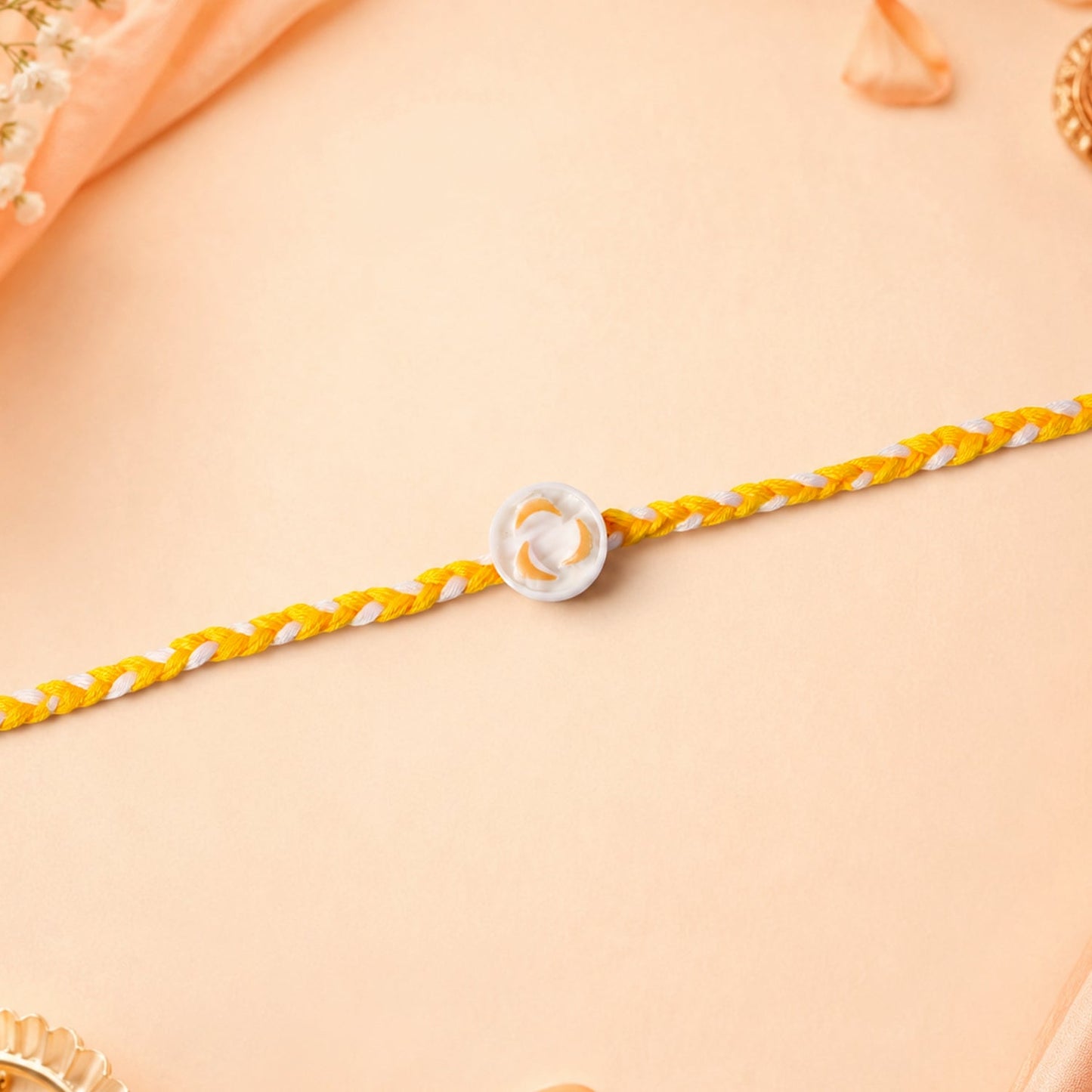 Side angle view of White Round Charm Fancy Dori Rakhi highlighting craftsmanship
