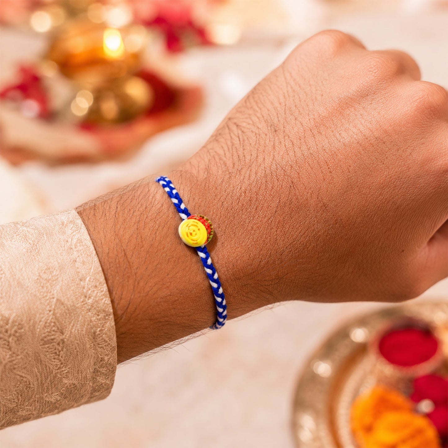 Close-up of Yellow Sweet Dessert Dori Rakhi detailing