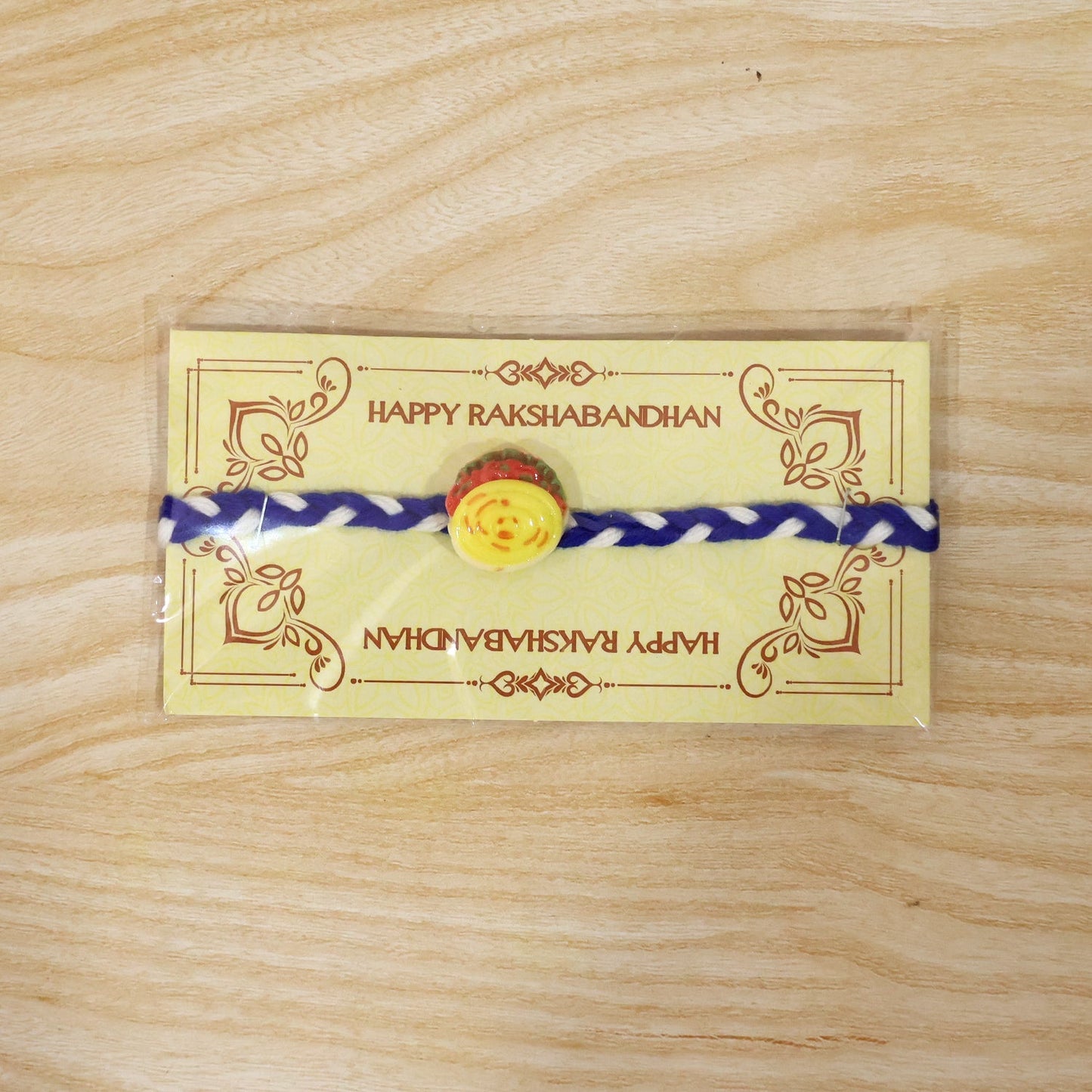 Yellow Sweet Dessert Dori Rakhi in packaging view