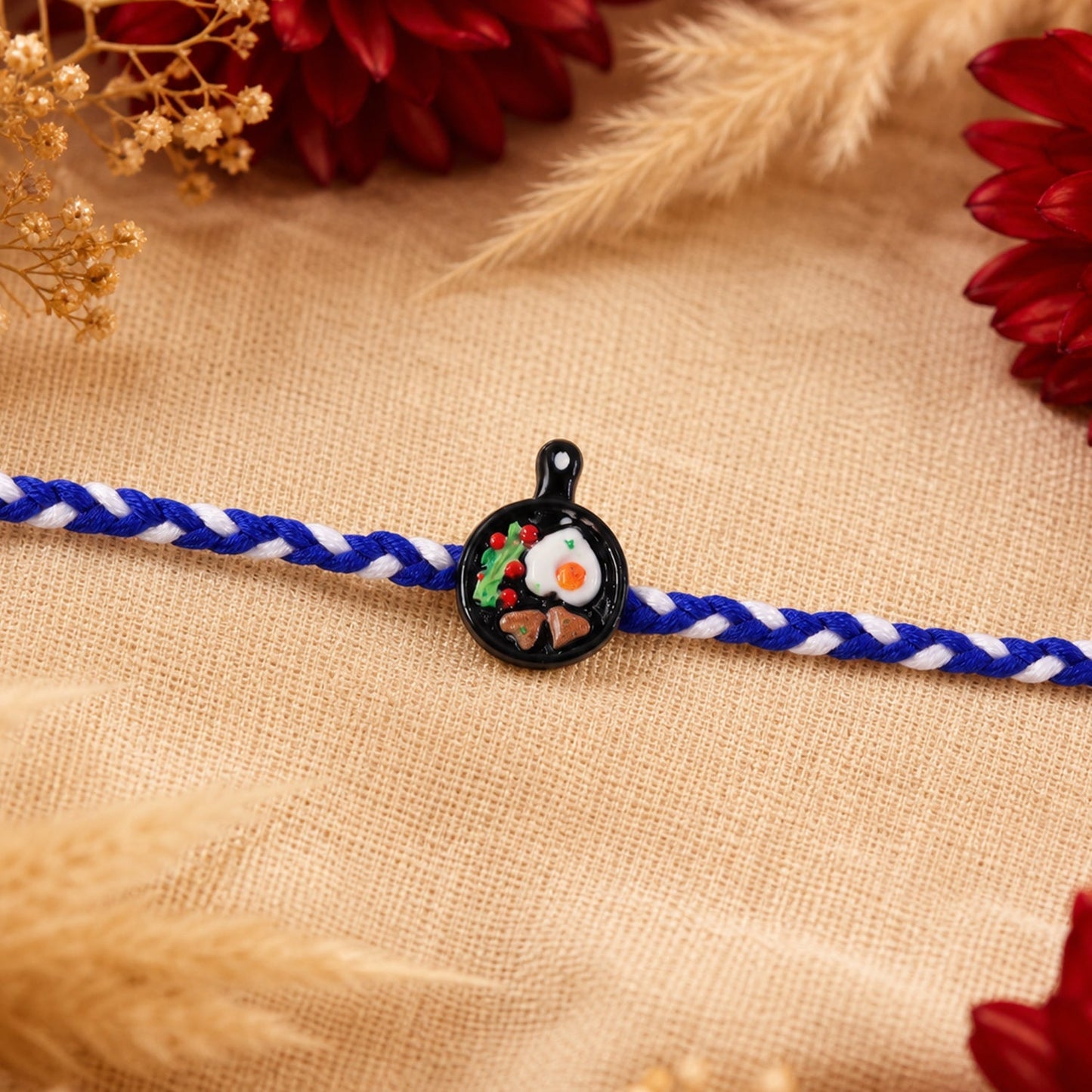 Full design view of mini frying pan Rakhi, trending sibling gift