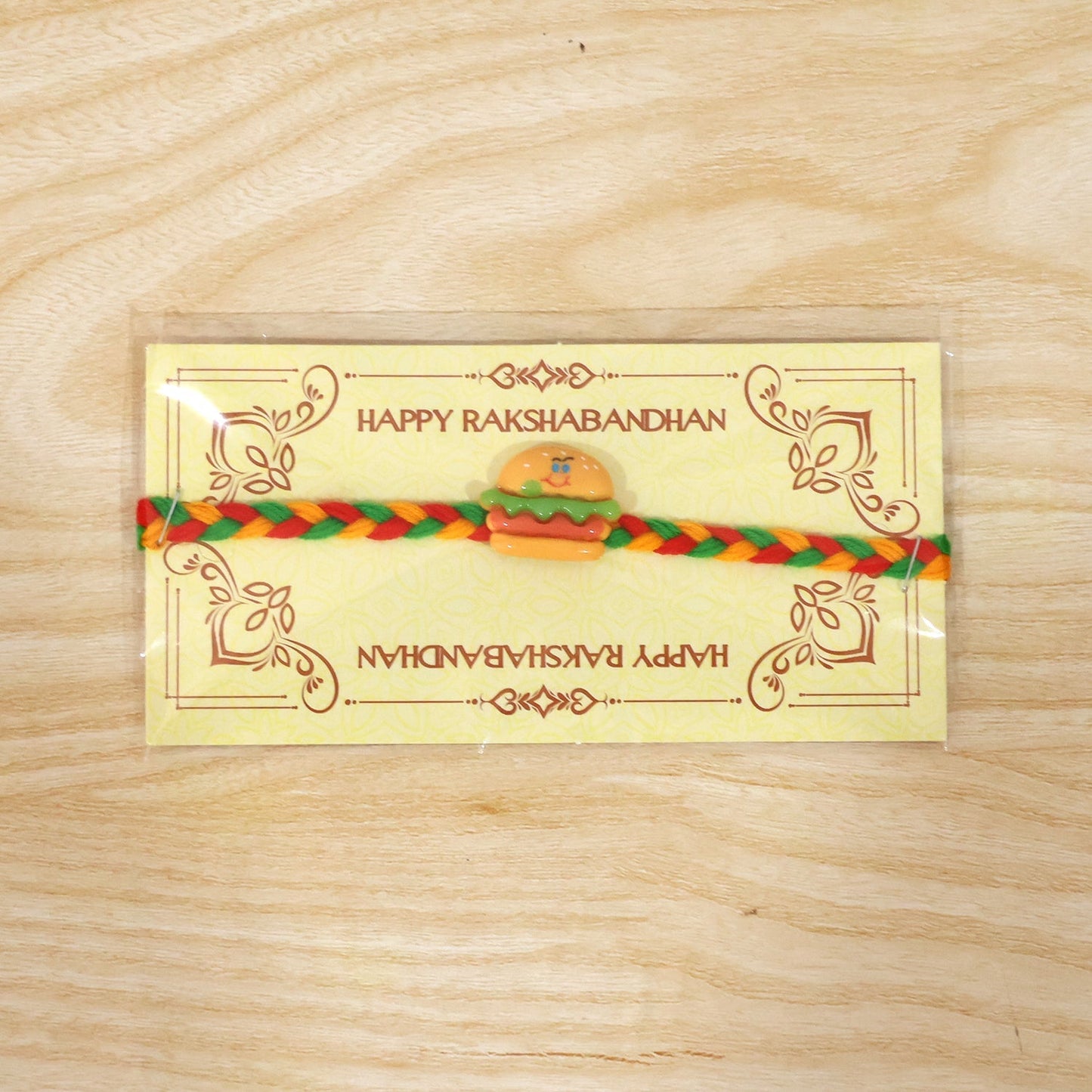 Full view of the stylish and playful Burger Charm Rakhi.