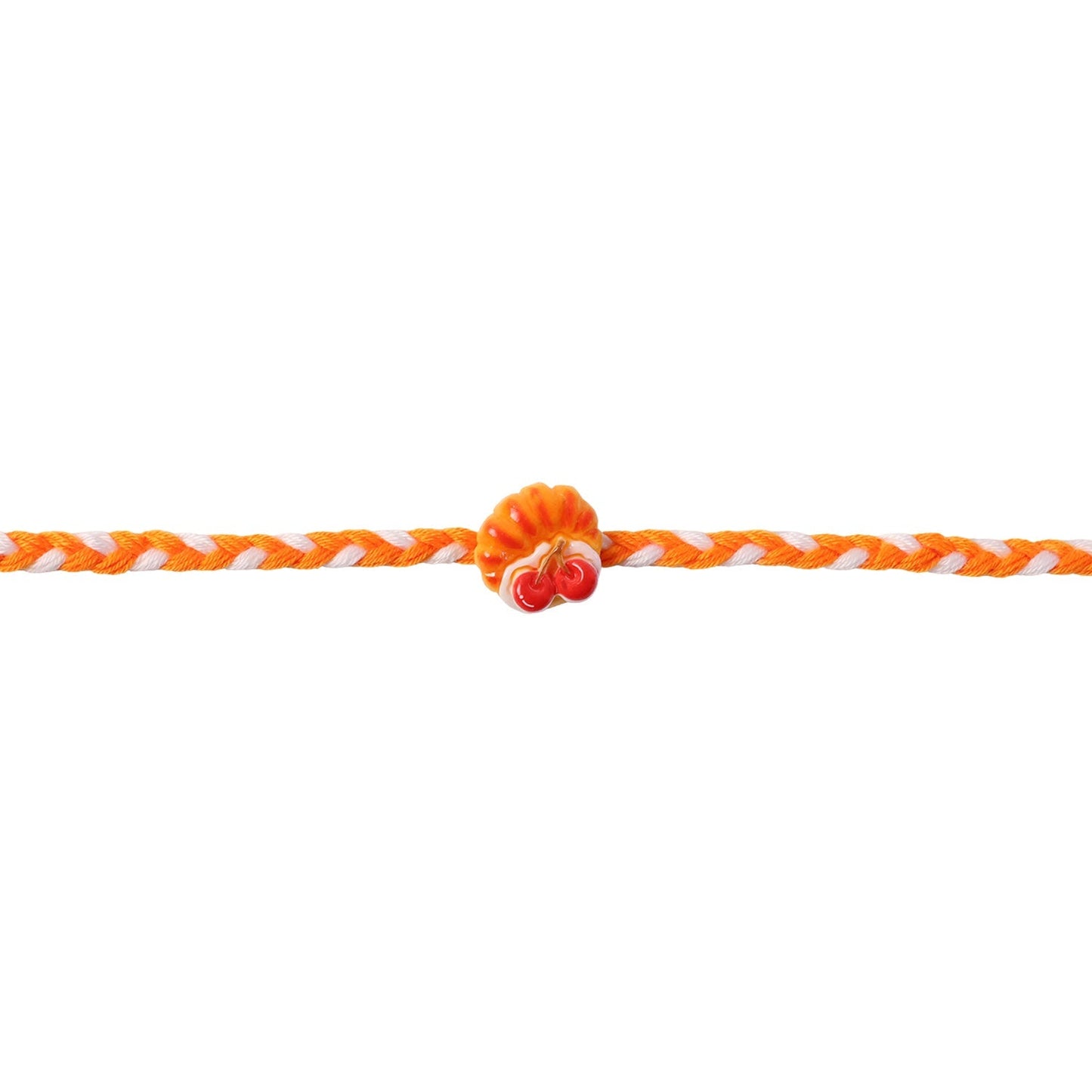 Cherry Pastry Charm Rakhi presented in elegant packaging, ideal for gifting.