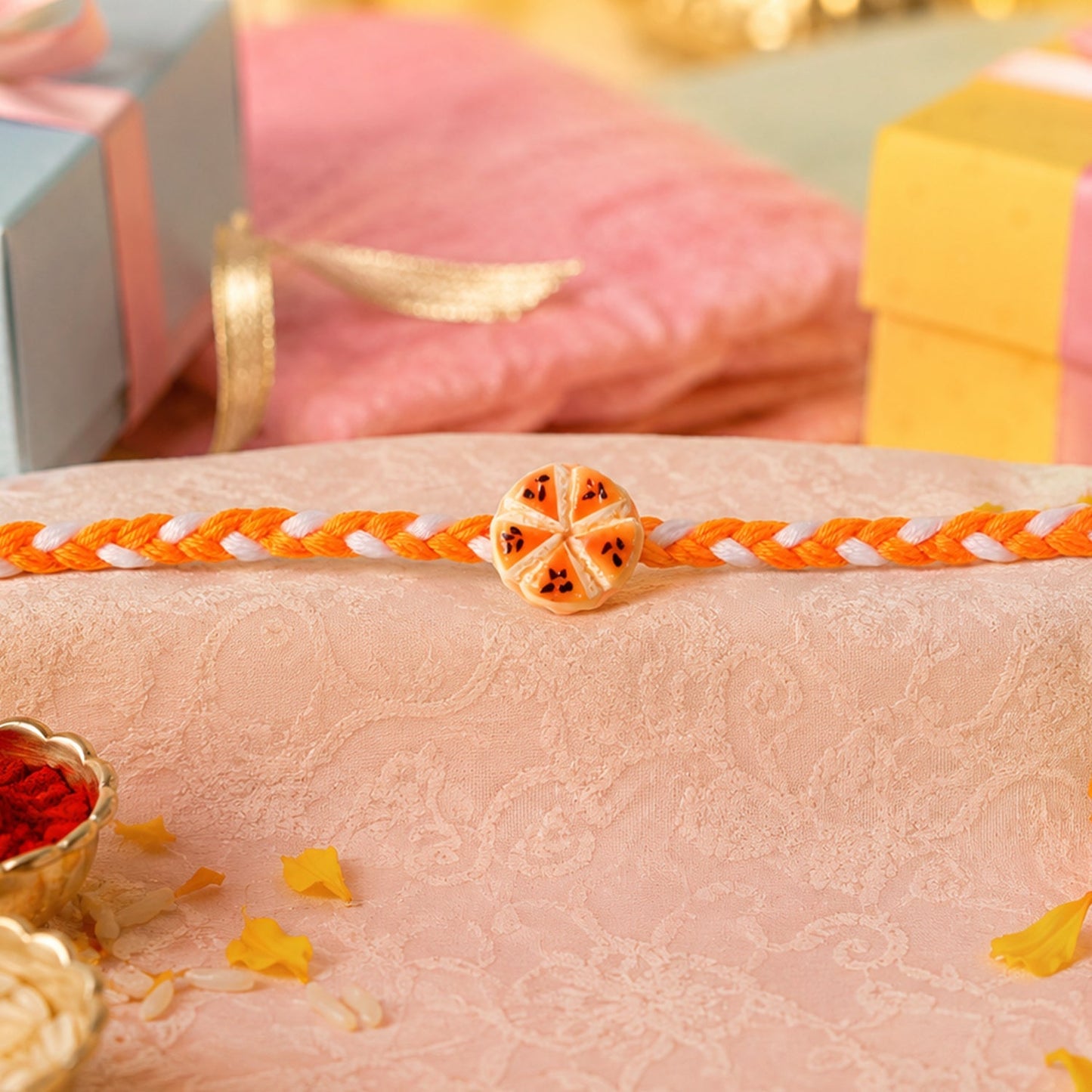 Rakhi showing thread and unique orange slice charm