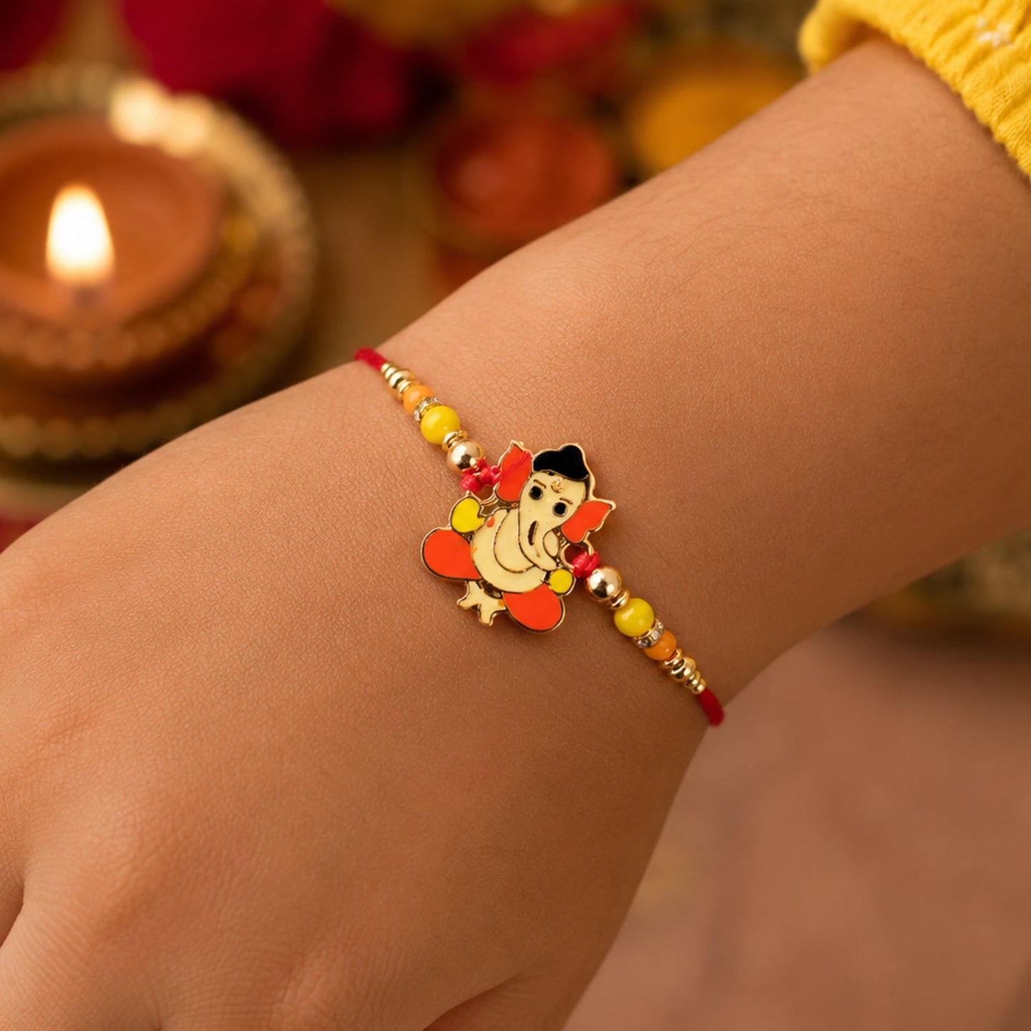 Close-up of designer rakhi with divine idol and beads