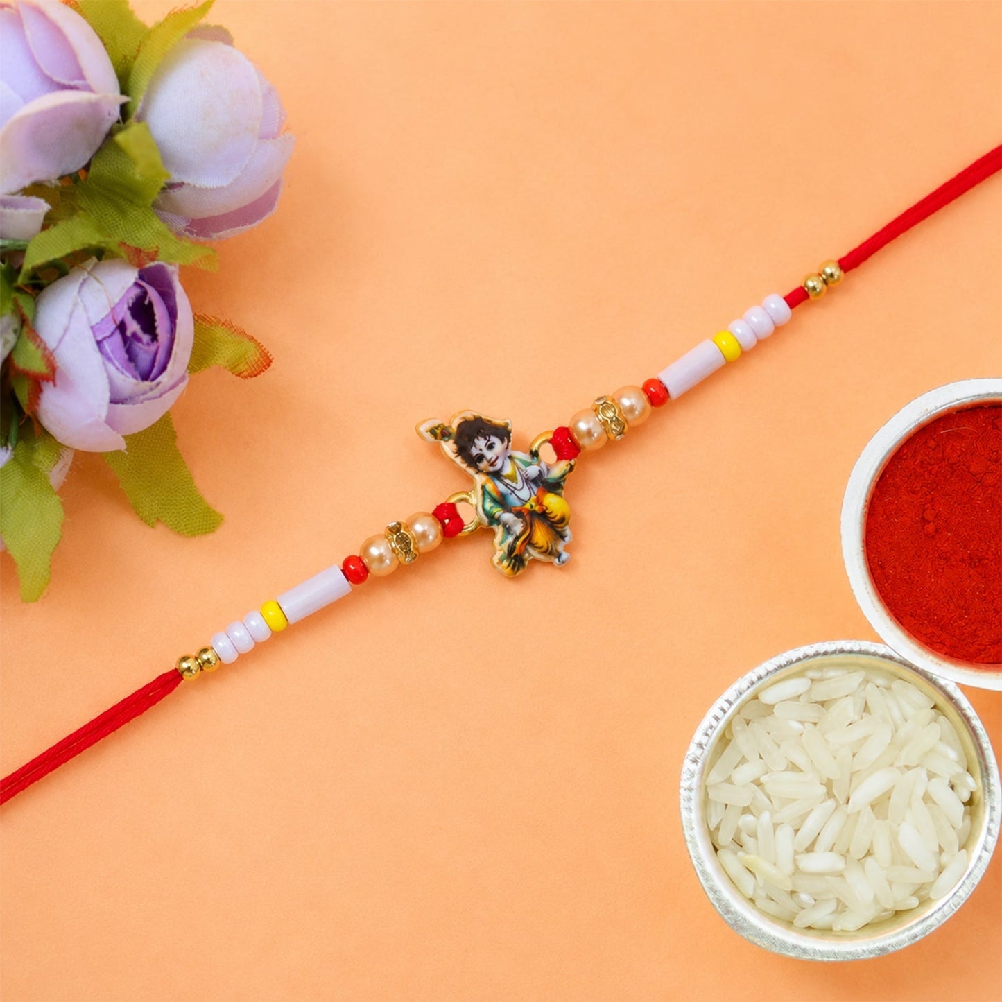 Detailed view of beads on Krishna Rakhi with vibrant colors