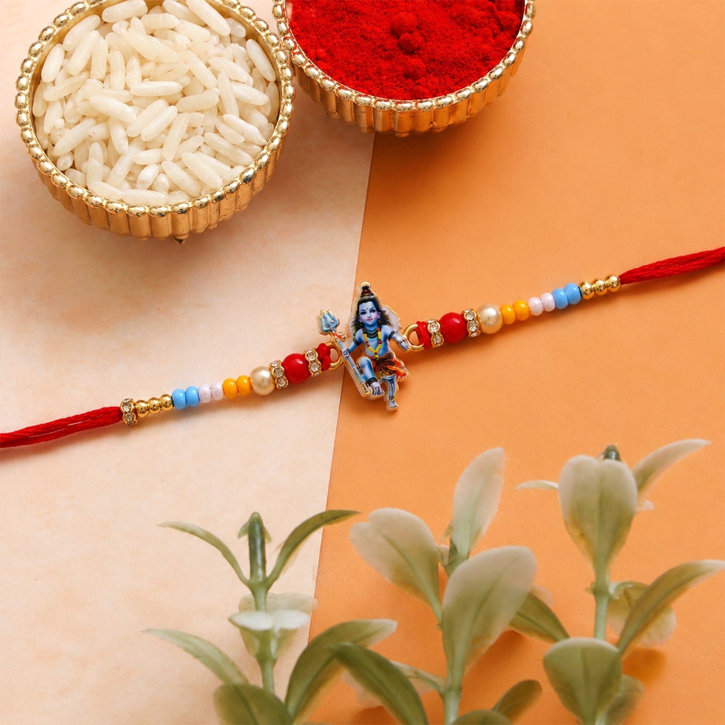 Stylish traditional rakhi with Mahadev charm and beads