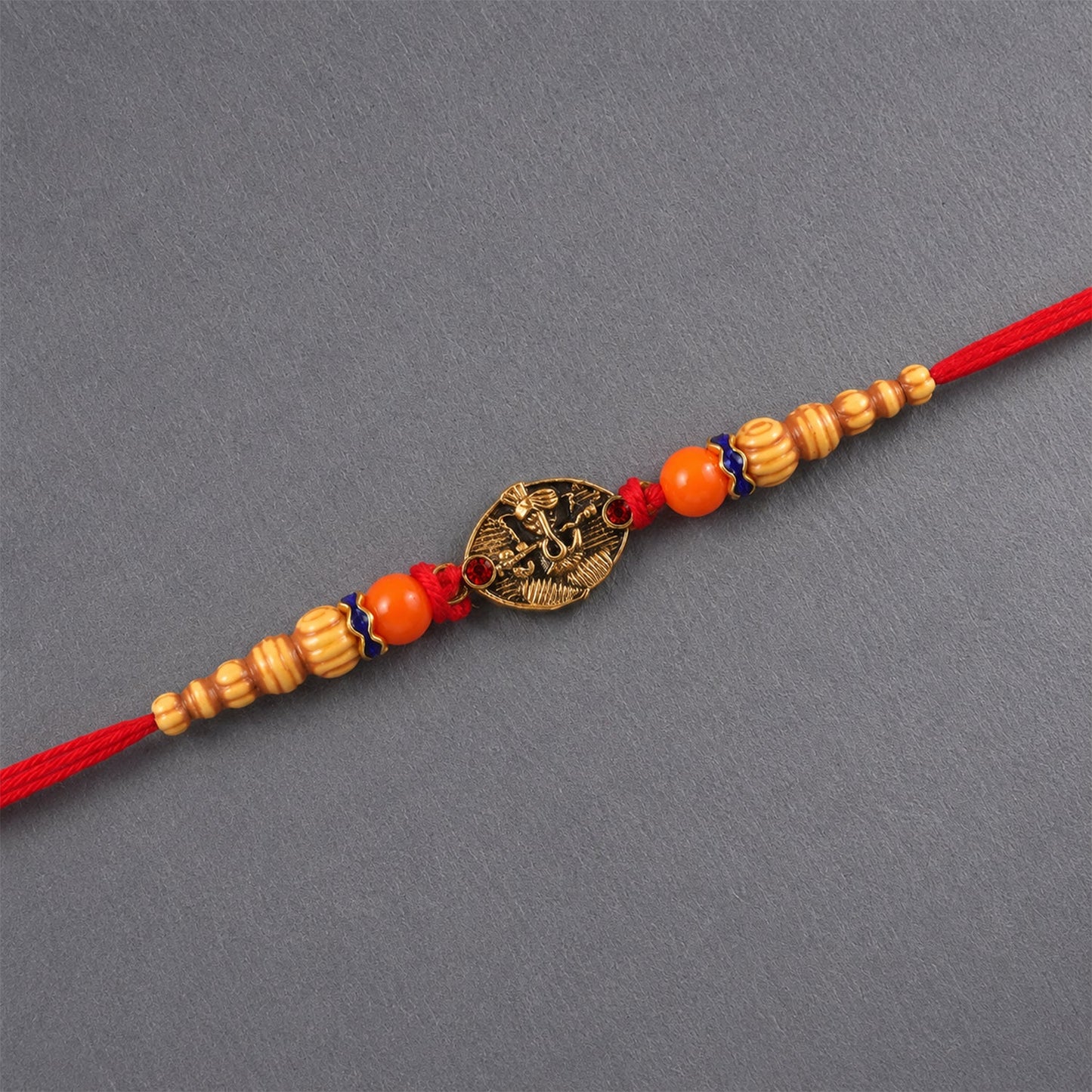 Side view of antique charm Rakhi for Raksha Bandhan