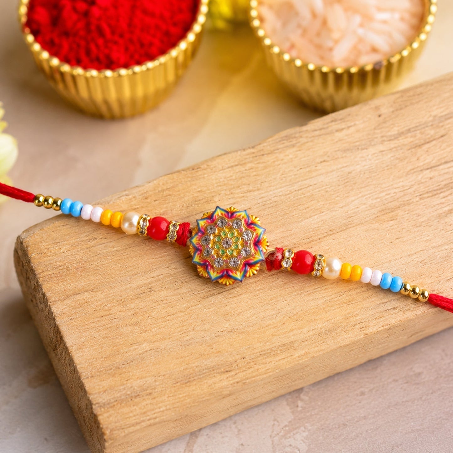 Top view of designer Rangoli Mandala Rakhi with beads