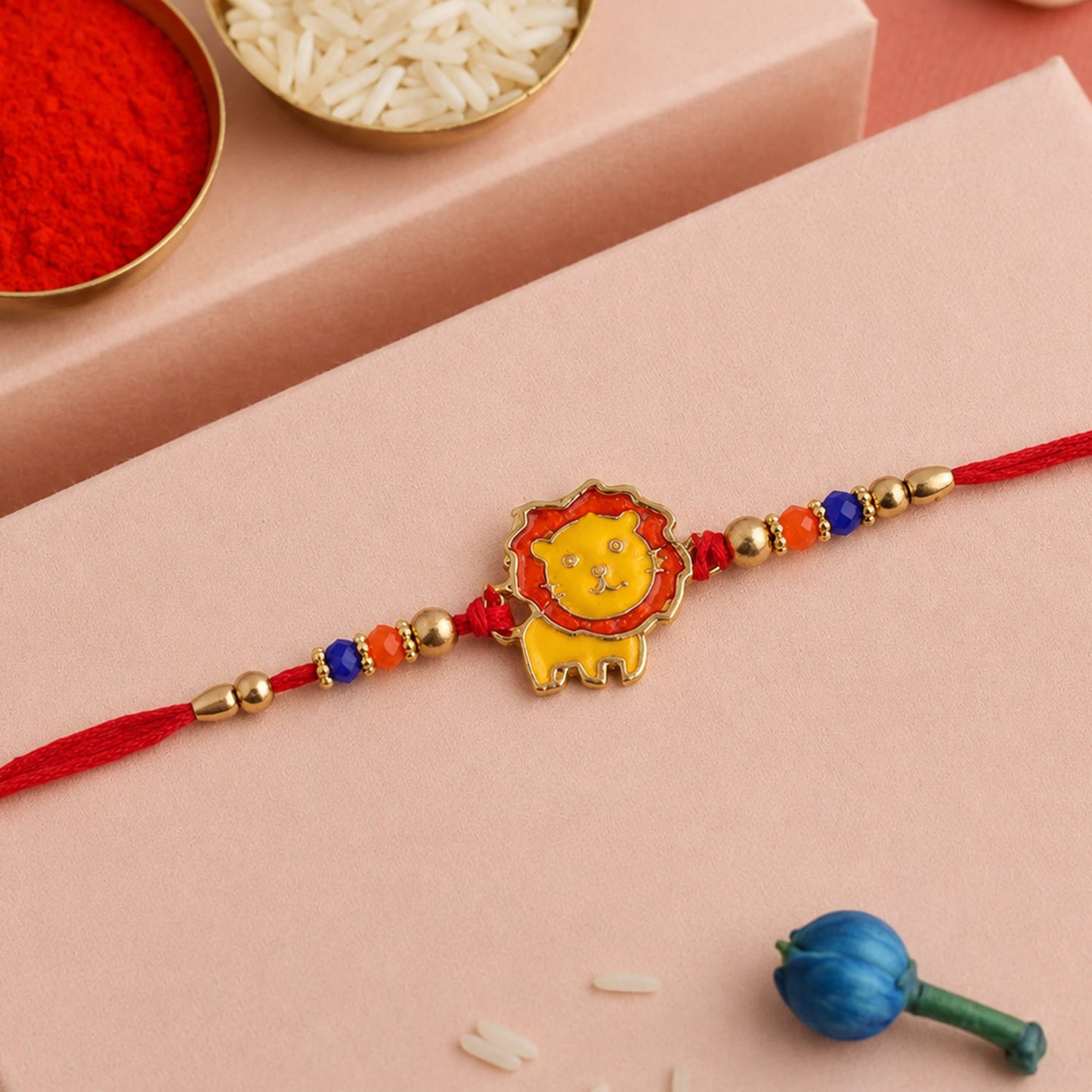 Side angle of stylish lion charm kids rakhi