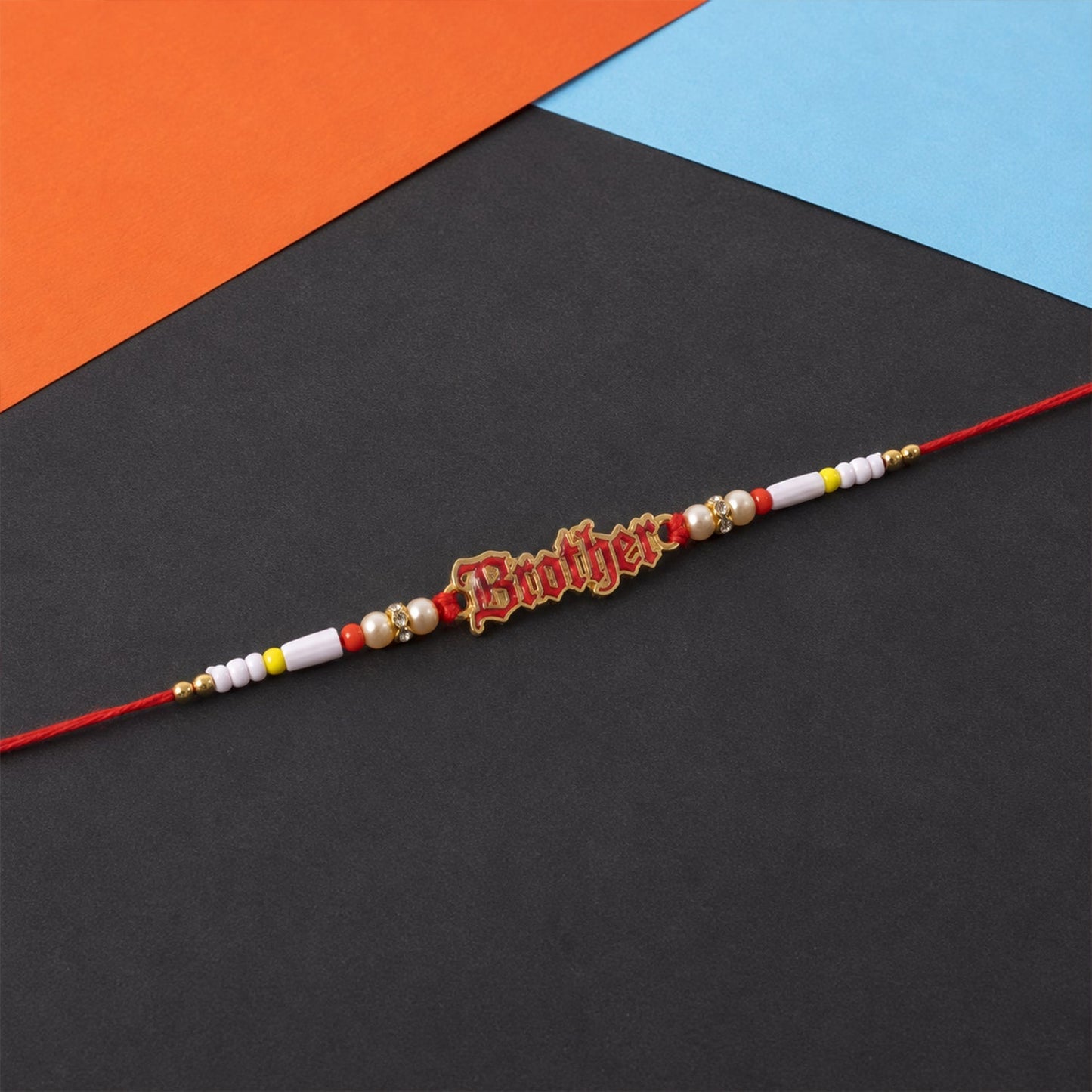 Traditional and modern style Rakhi with pearl beads and text charm