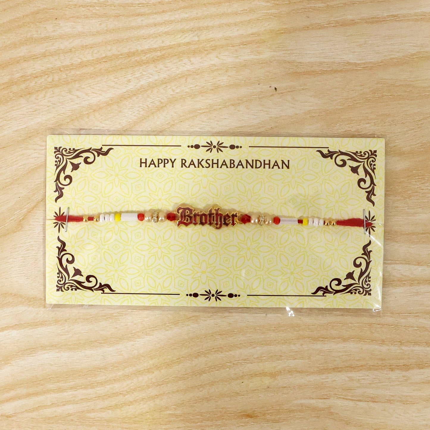 Lightweight Rakhi with pearl beads and text charm, easy to wear