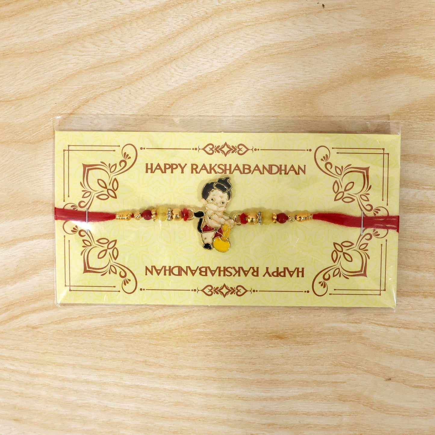 Full length view of Bal Hanuman Gada charm Rakhi