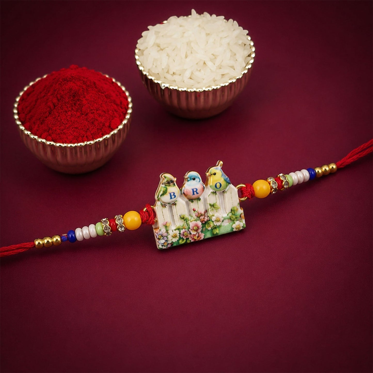 Close-up of the BRO Rakhi, highlighting cute bird charms and colorful beads.