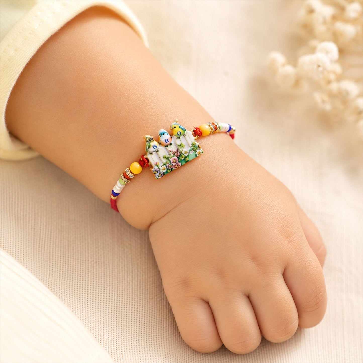 Elegant BRO Rakhi with unique bird design and intricate beadwork.