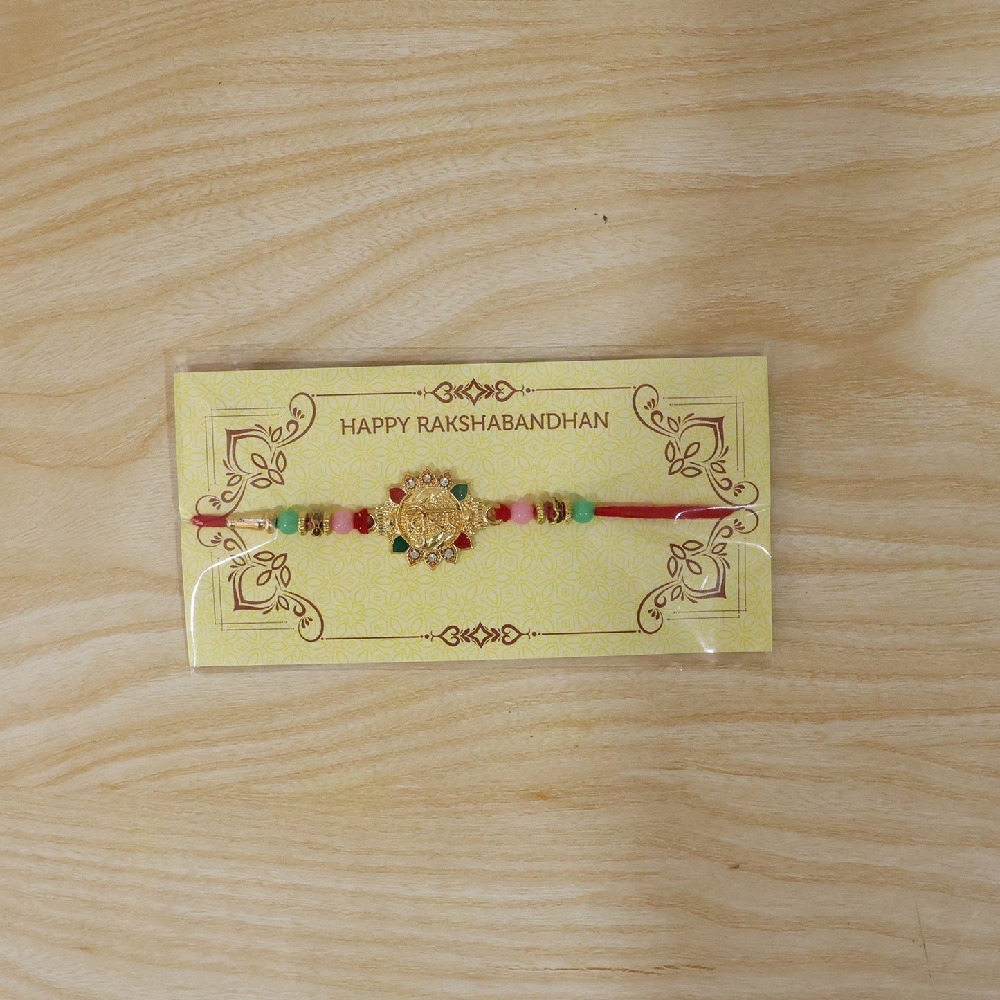 Detailed shot of Veera charm and thread on Rakhi
