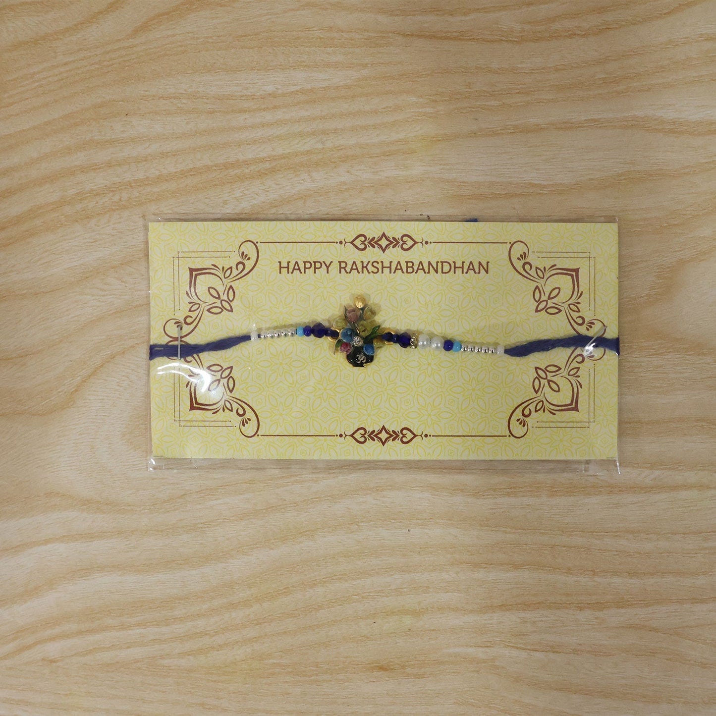 Traditional Rakhi with beads and Meena charm