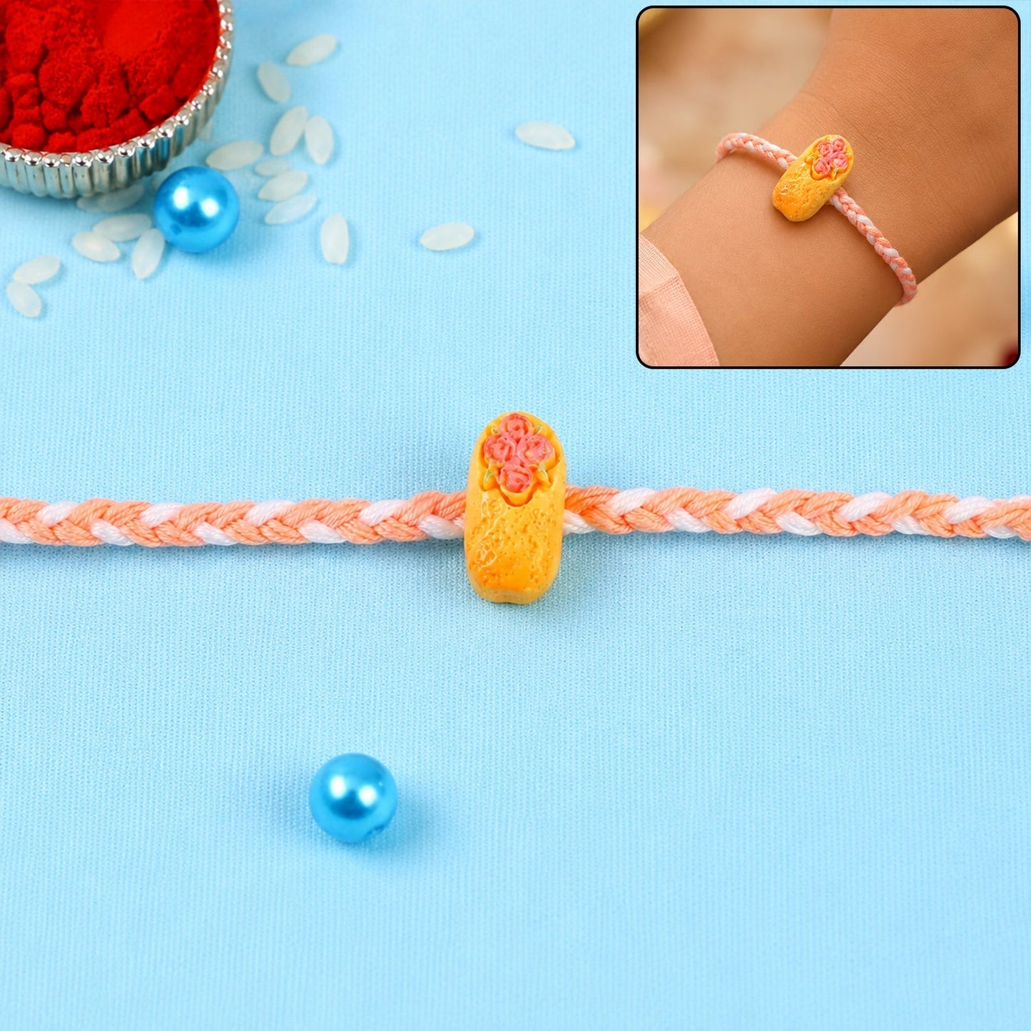 Cute cake charm Kids Rakhi with braided thread, perfect for your brother.