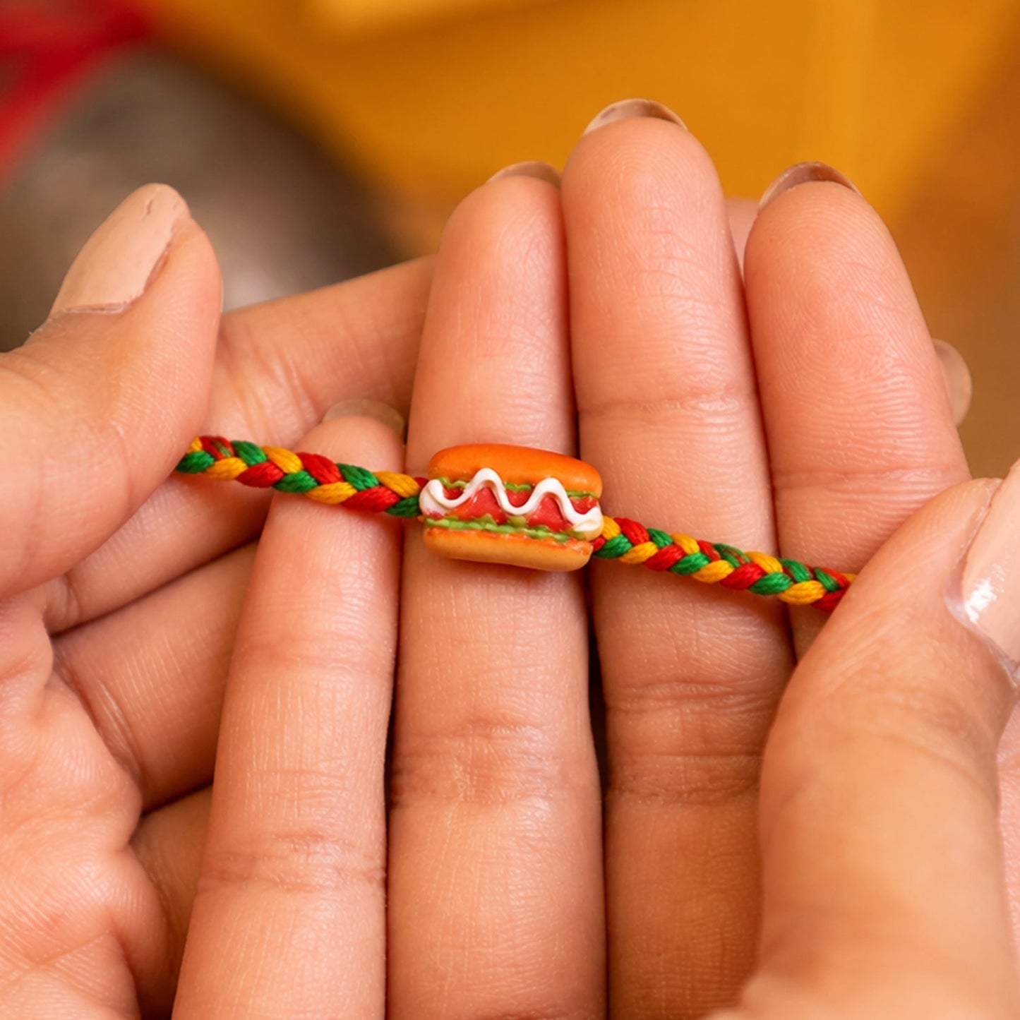 Raksha Bandhan Rakhi with playful hot dog and burger charms