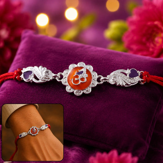 Silver Om floral charm Rakhi with red dori thread for brother