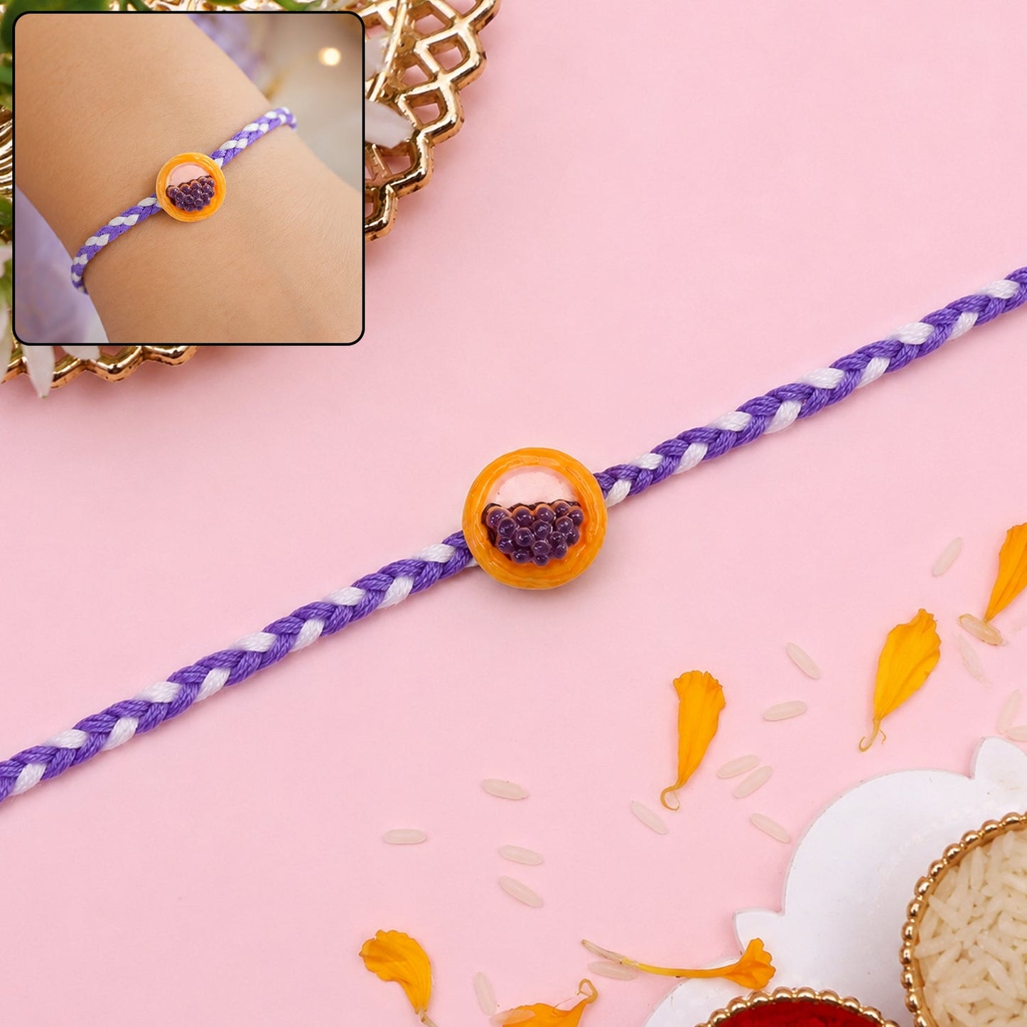 Front view of a cute grapes basket braided thread Rakhi