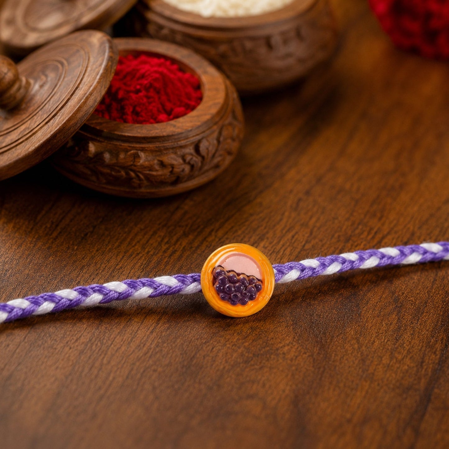 Close-up of knot on a grapes basket Rakhi with modern design