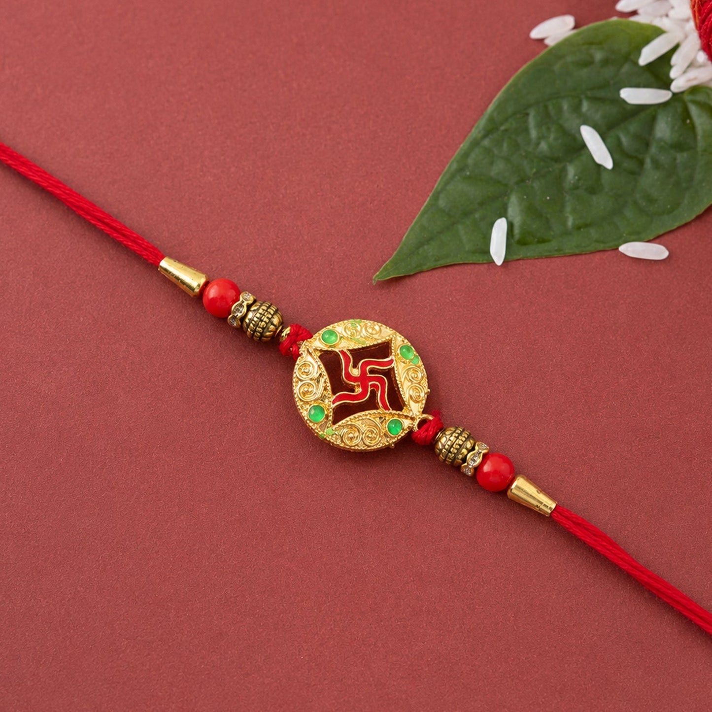 Golden charm Rakhi tied with colorful threads for festival
