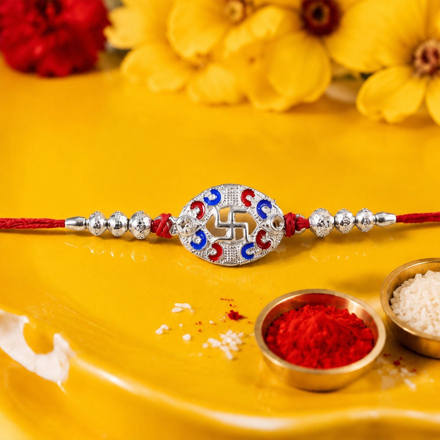 Close-up detail of Swastik charm on the Rakhi
