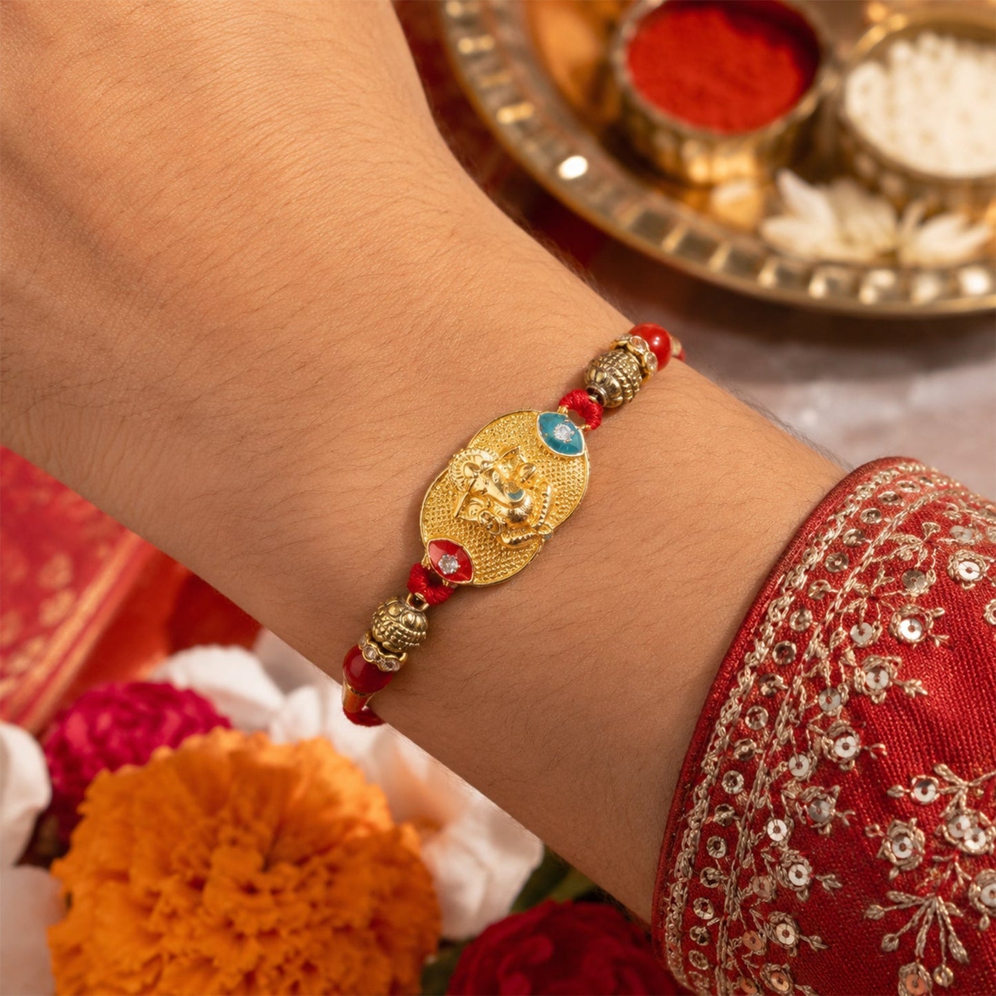 Golden Ganesh oval charm Rakhi showing thread and beads