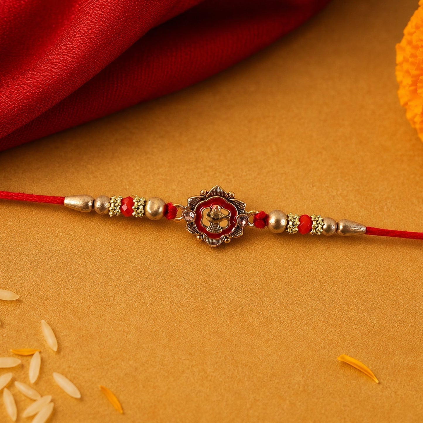 Close-up of floral Shivling charm on Rakhi