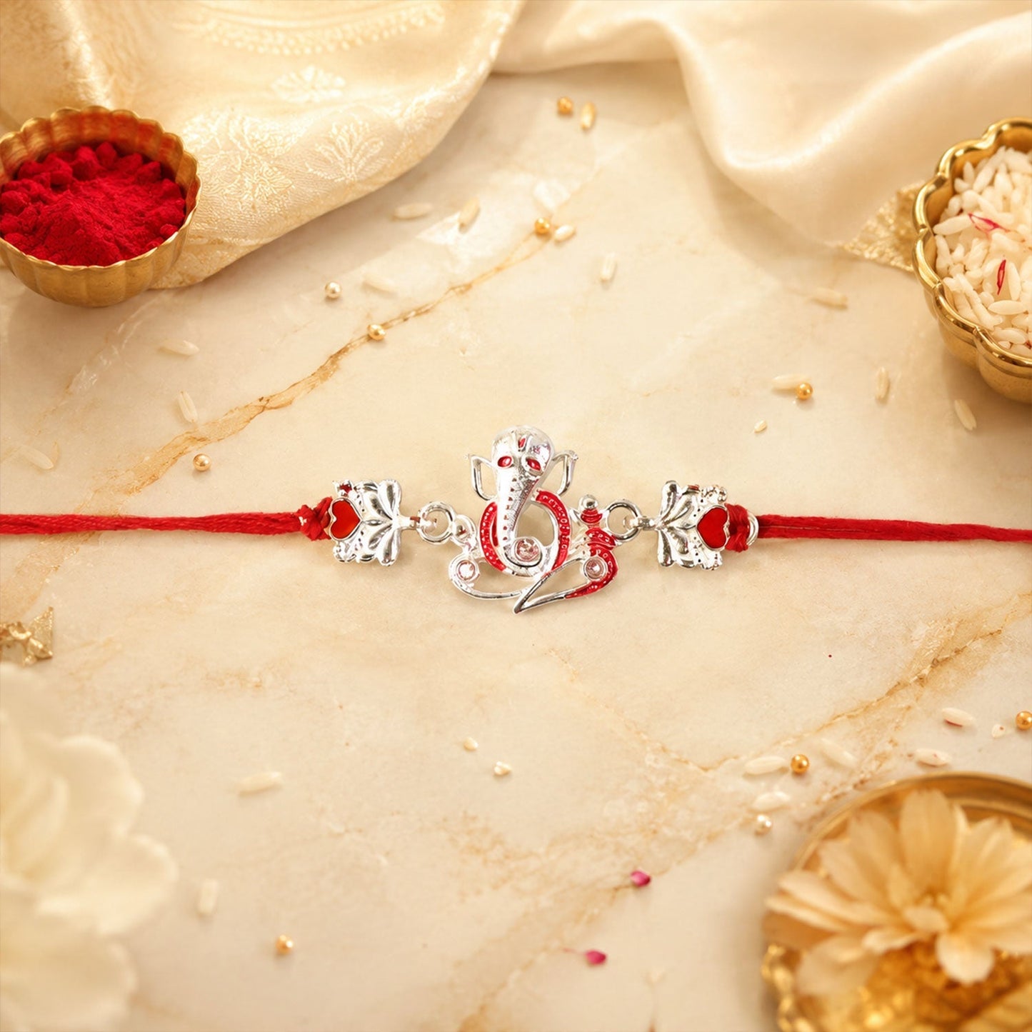 Side view of lightweight Silver Ganpati Heart Charm Rakhi
