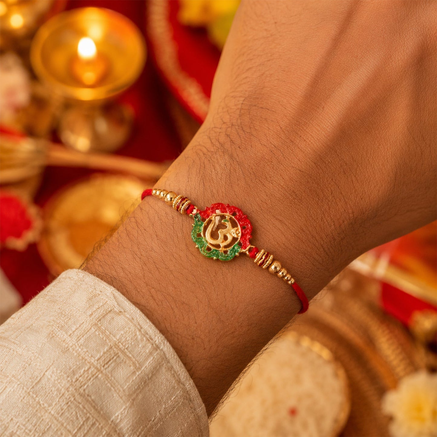 Top view of golden Om Meena charm rakhi for brother