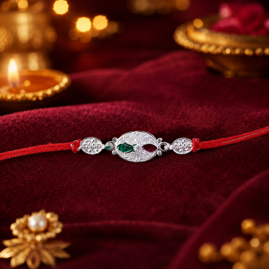Close-up of Silver Oval Floral Stone Rakhi highlighting detailed design