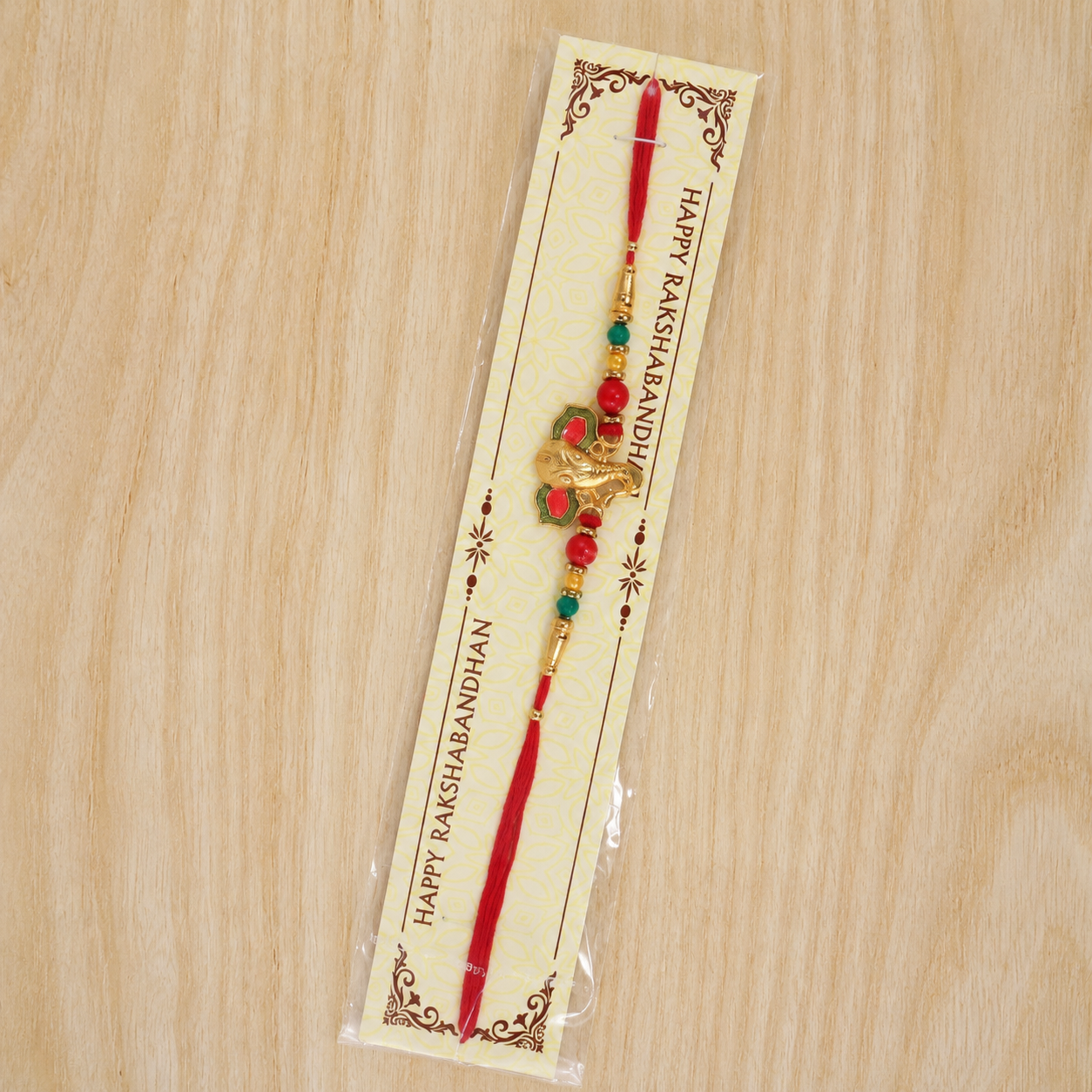 Full view of Ganesha rakhi with vibrant beads