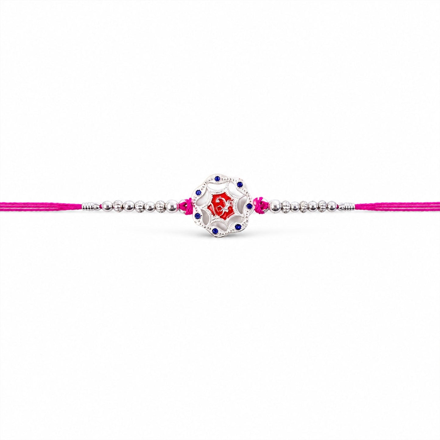 Top view of silver floral stone charm rakhi with beads, festival accessory