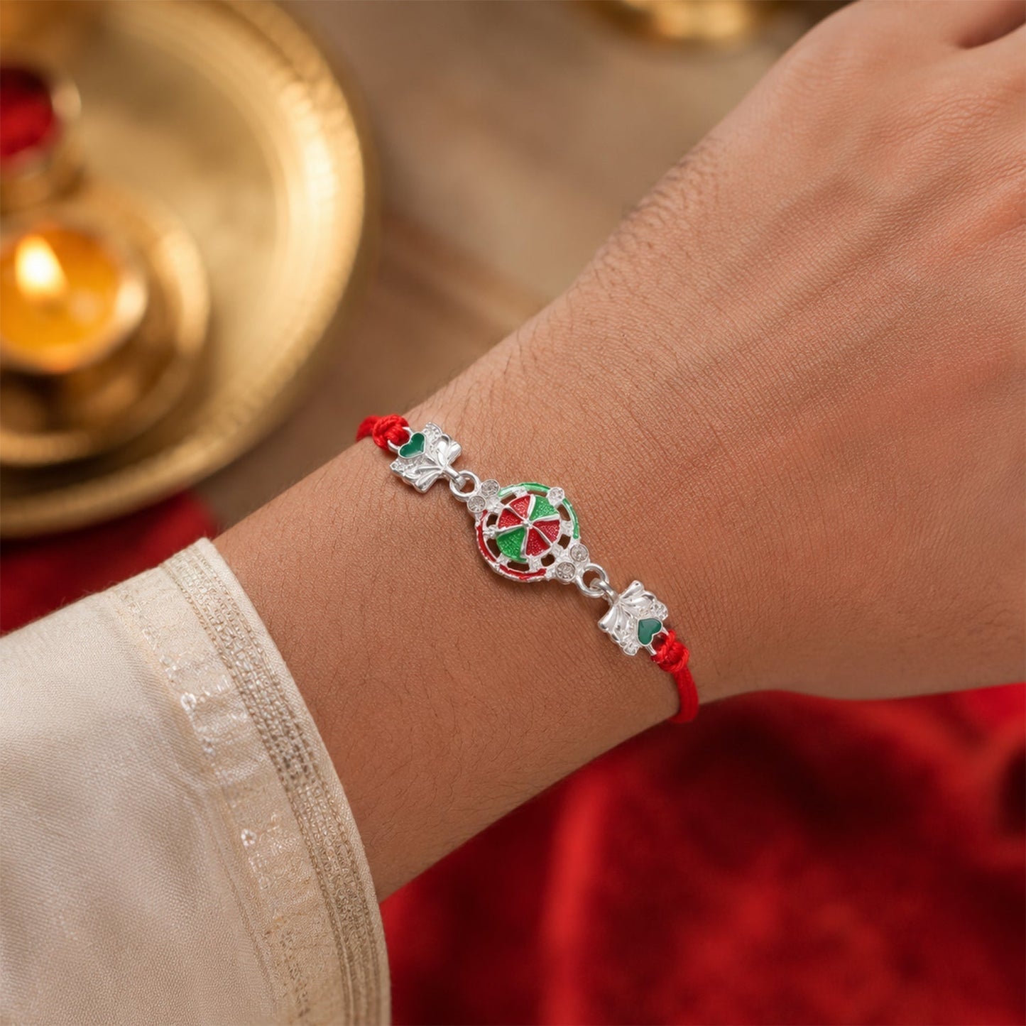 Close-up of silver heart charm on rakhi thread