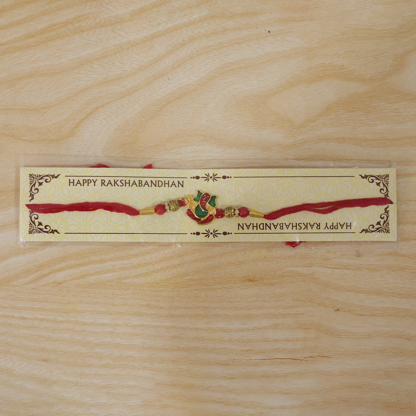 Traditional Lord Ganesha meenakari rakhi in bright festive colors