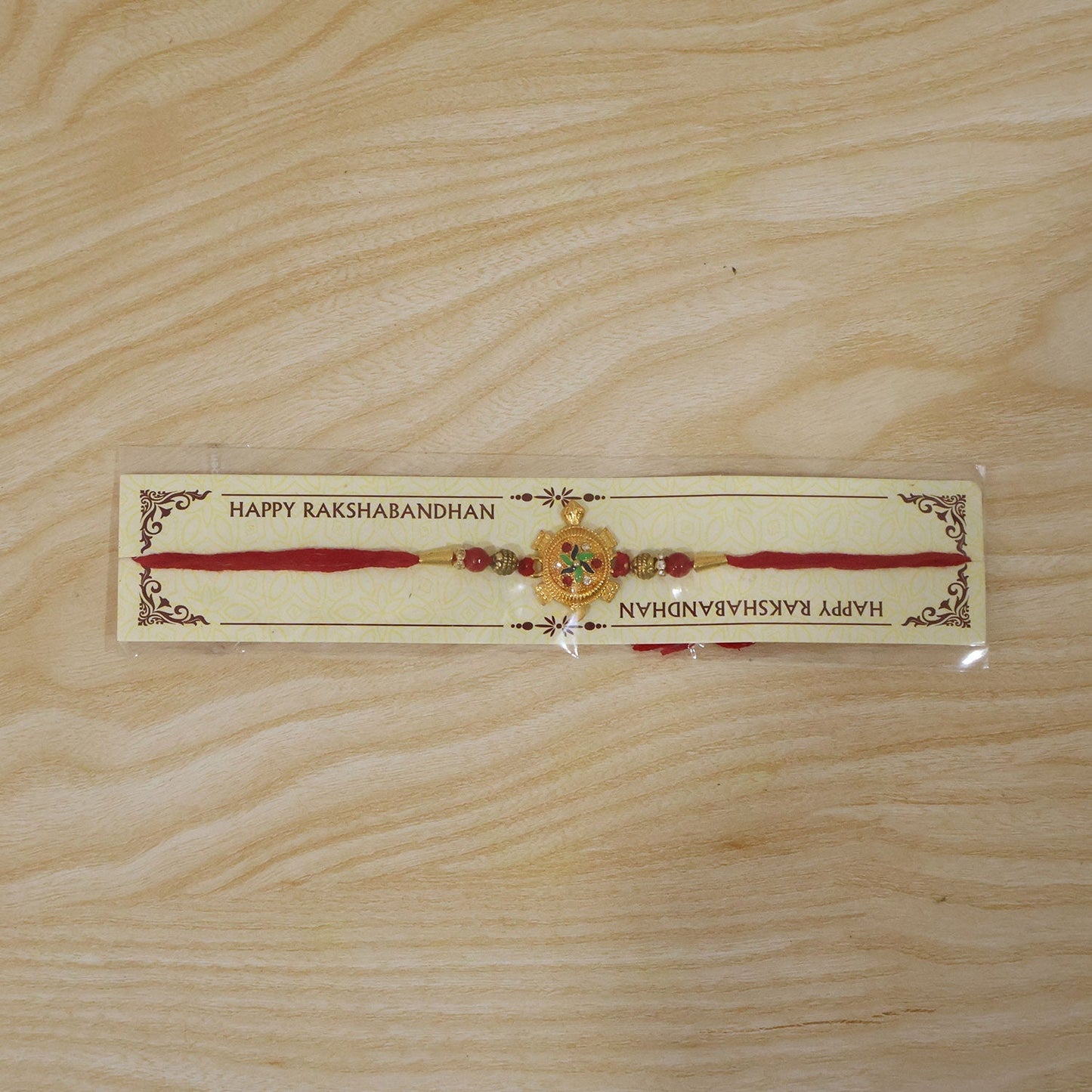 Festive Golden Tortoise Rakhi with intricate detailing and attractive centerpiece