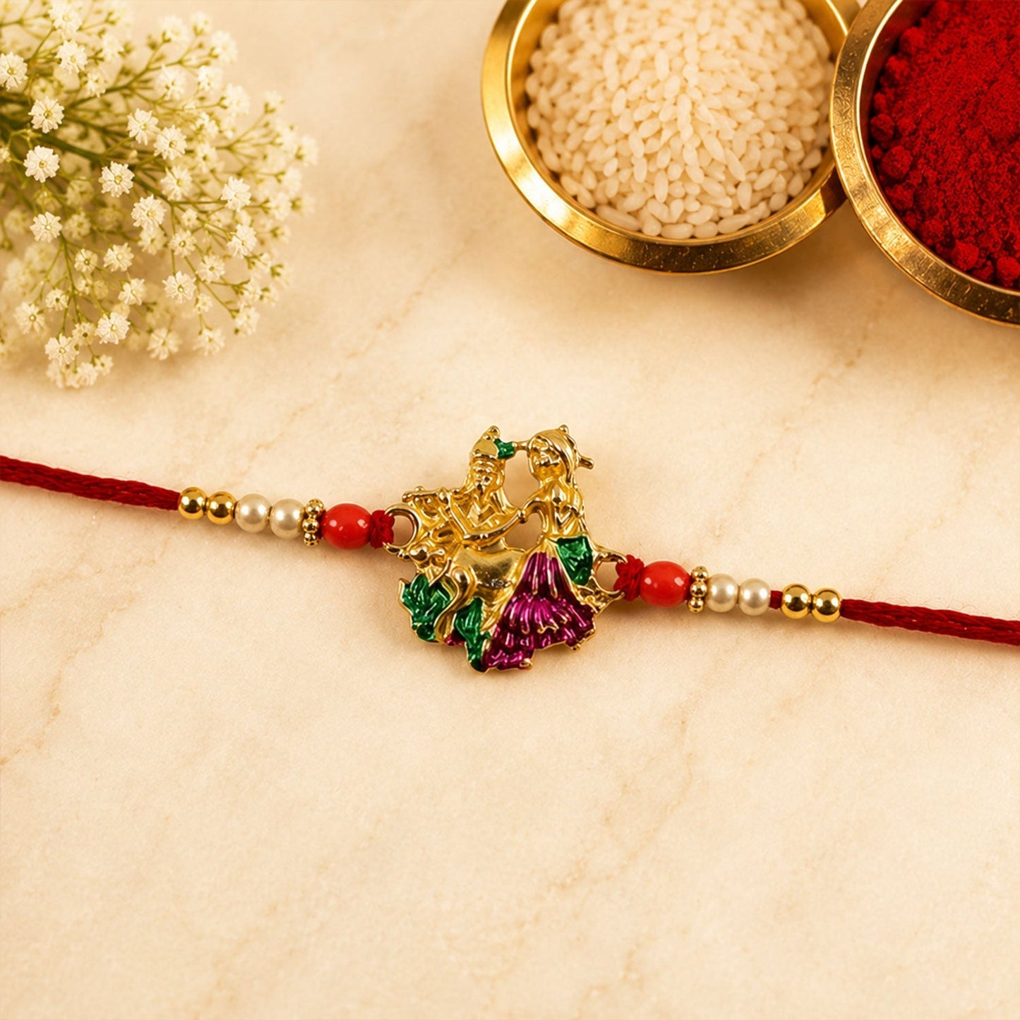 Colorful Meenakari Radhe Krishna Rakhi with decorative beads on vibrant thread